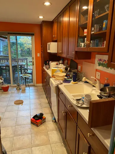 Kitchen before cleaning with cluttered counters