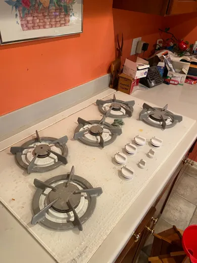 Stovetop before cleaning with burnt residue