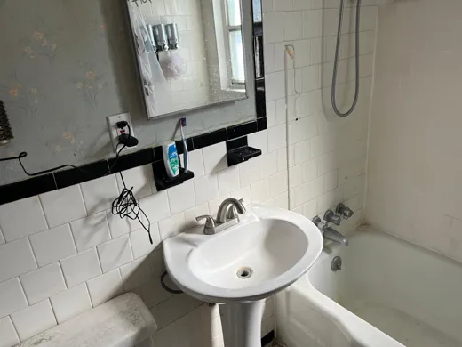 Bathroom before cleaning with soiled sink area