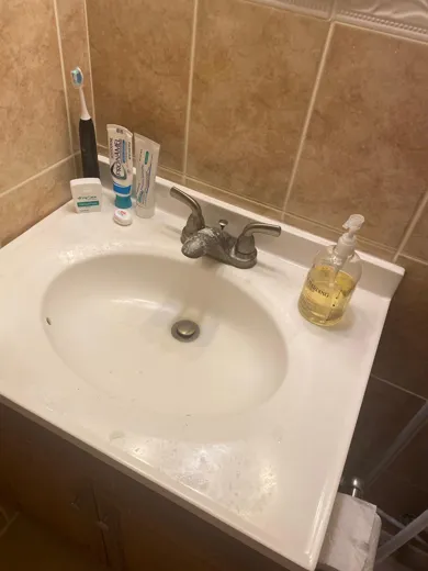 Bathroom sink and counter cleaned and polished