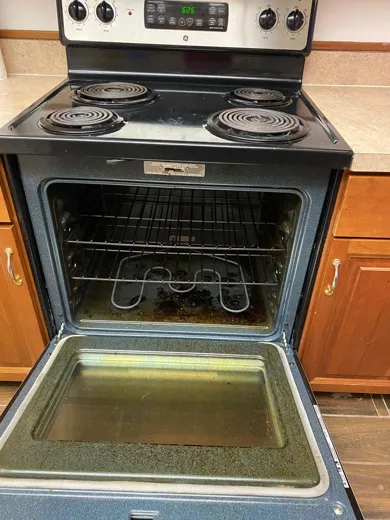 Oven before cleaning with baked-on spills