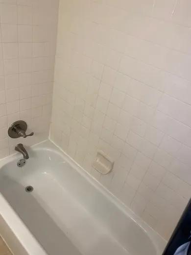 Shower wall tile and tub cleaned bright