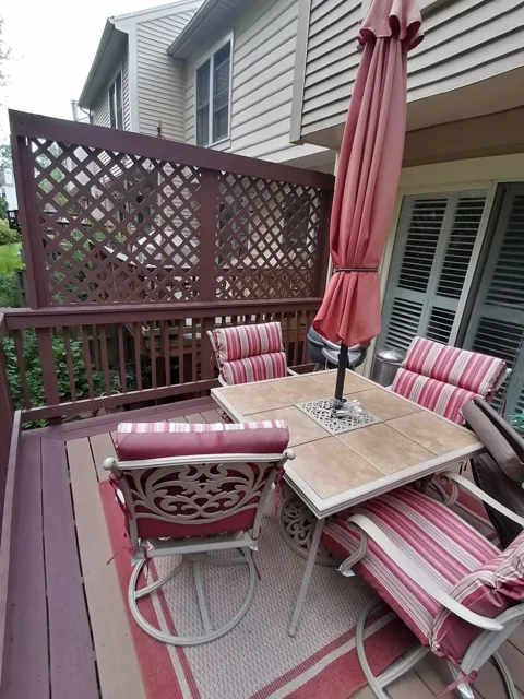 Outdoor patio furniture and deck cleaned and arranged